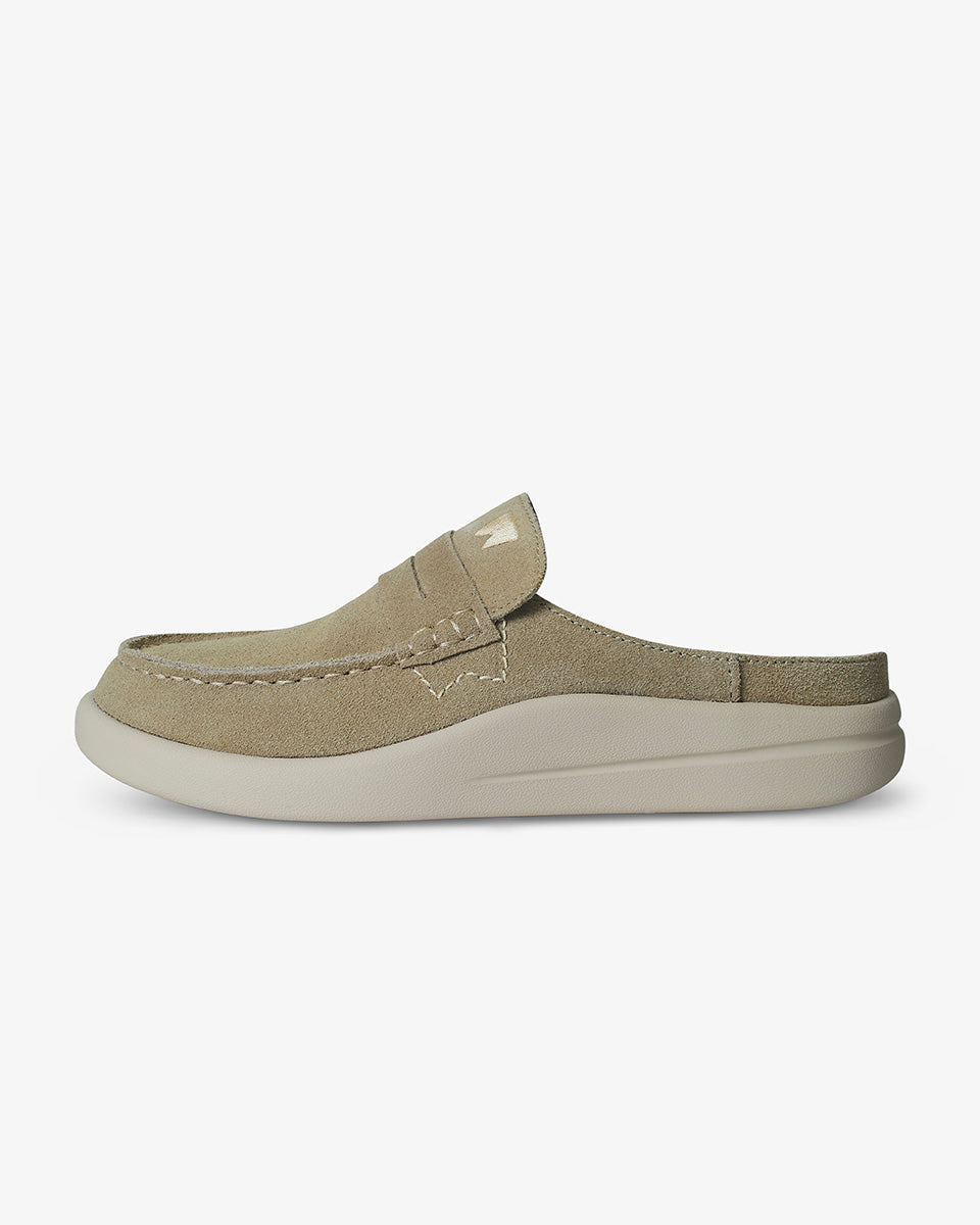 Beige slip-on shoe on a white background